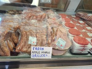 apple maple grillers and smoked pork chops wrapped and on display